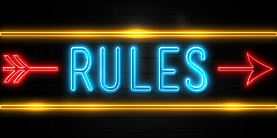 Rules  - fluorescent Neon Sign on brickwall Front view